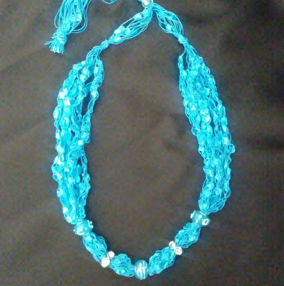 Homemade teal lace necklace.